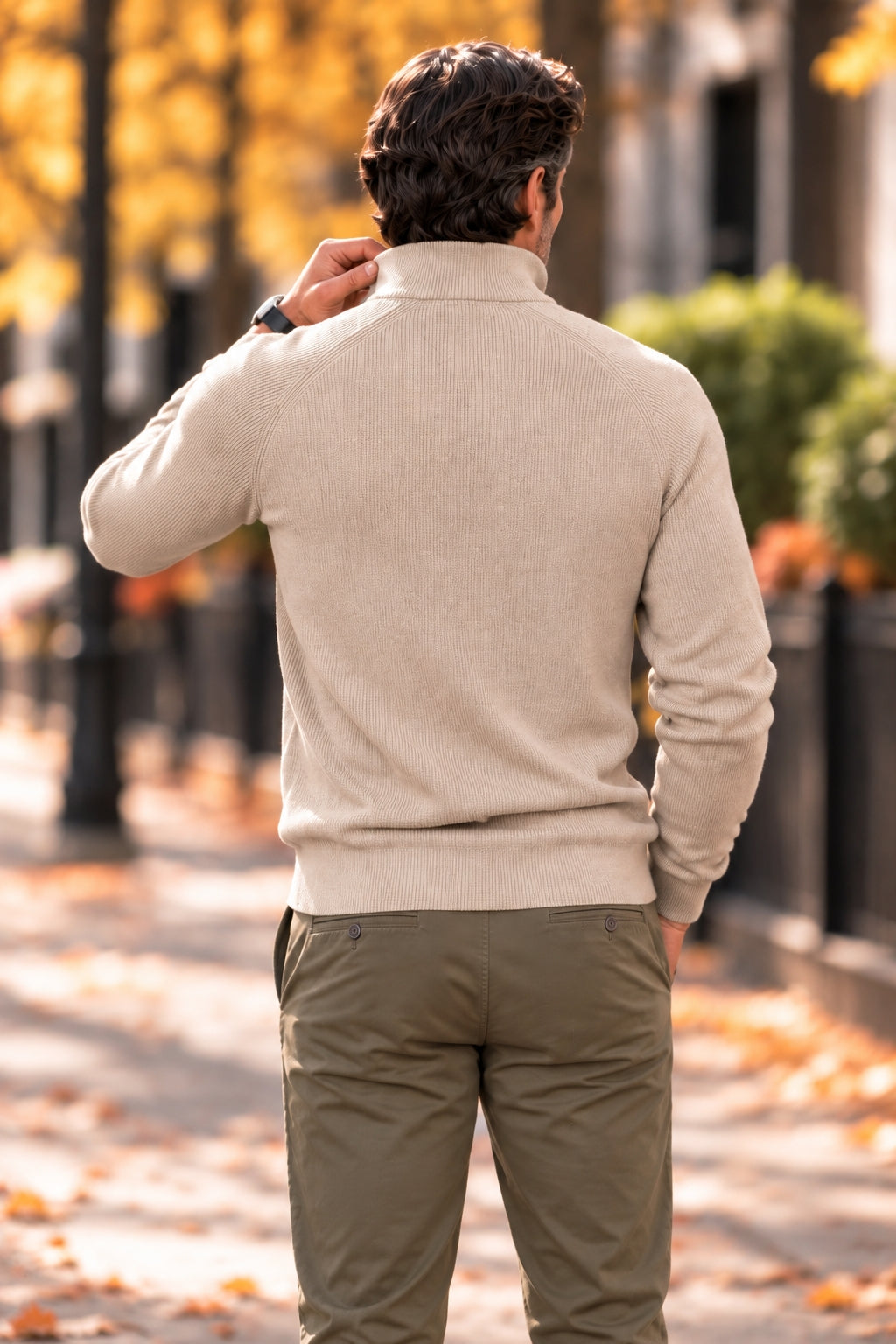 Back view of a beige ribbed-knit half-zip sweater