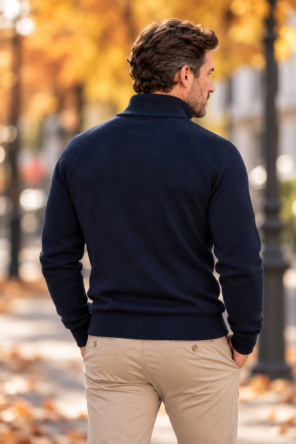 Back view of a navy ribbed-knit half-zip sweater