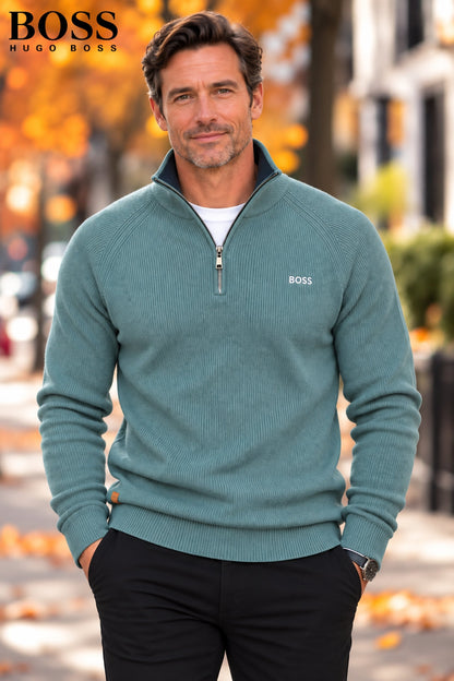 Man wearing a turquoise ribbed-knit half-zip sweater with chinos – front view